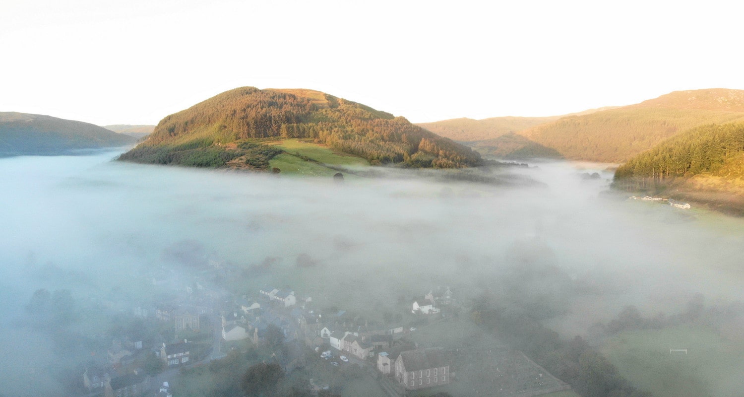 5am on a summer morning looking down to the village of Penmachno 5am on a summer morning looking down to the village of Penmachno