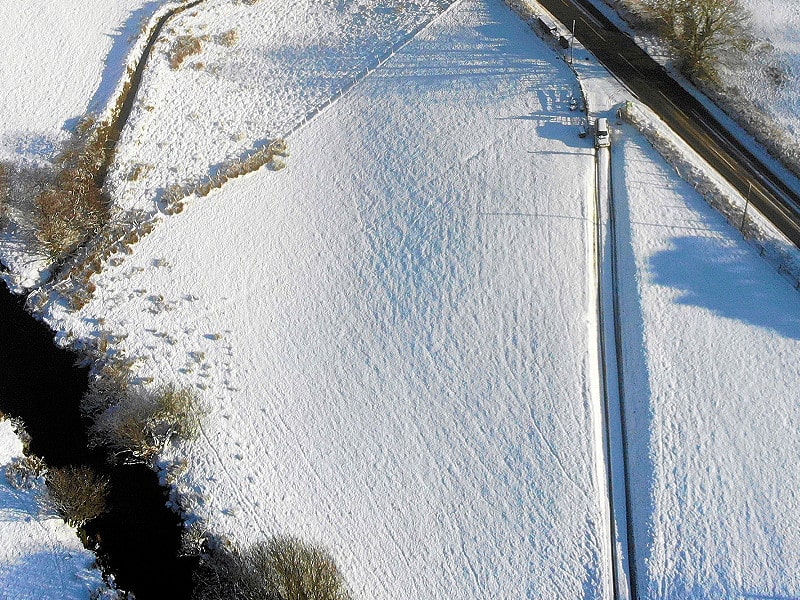 Snow between the road and the river Snow between the road and the river